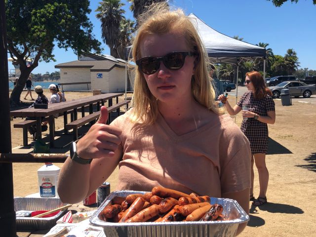 Student posing with her meal